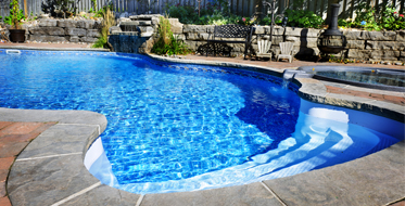 Swimming pool with waterfall