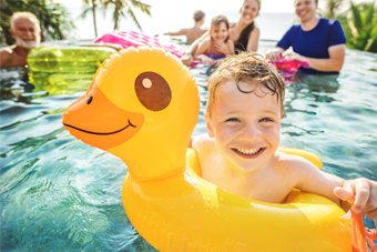 child swimming in pool